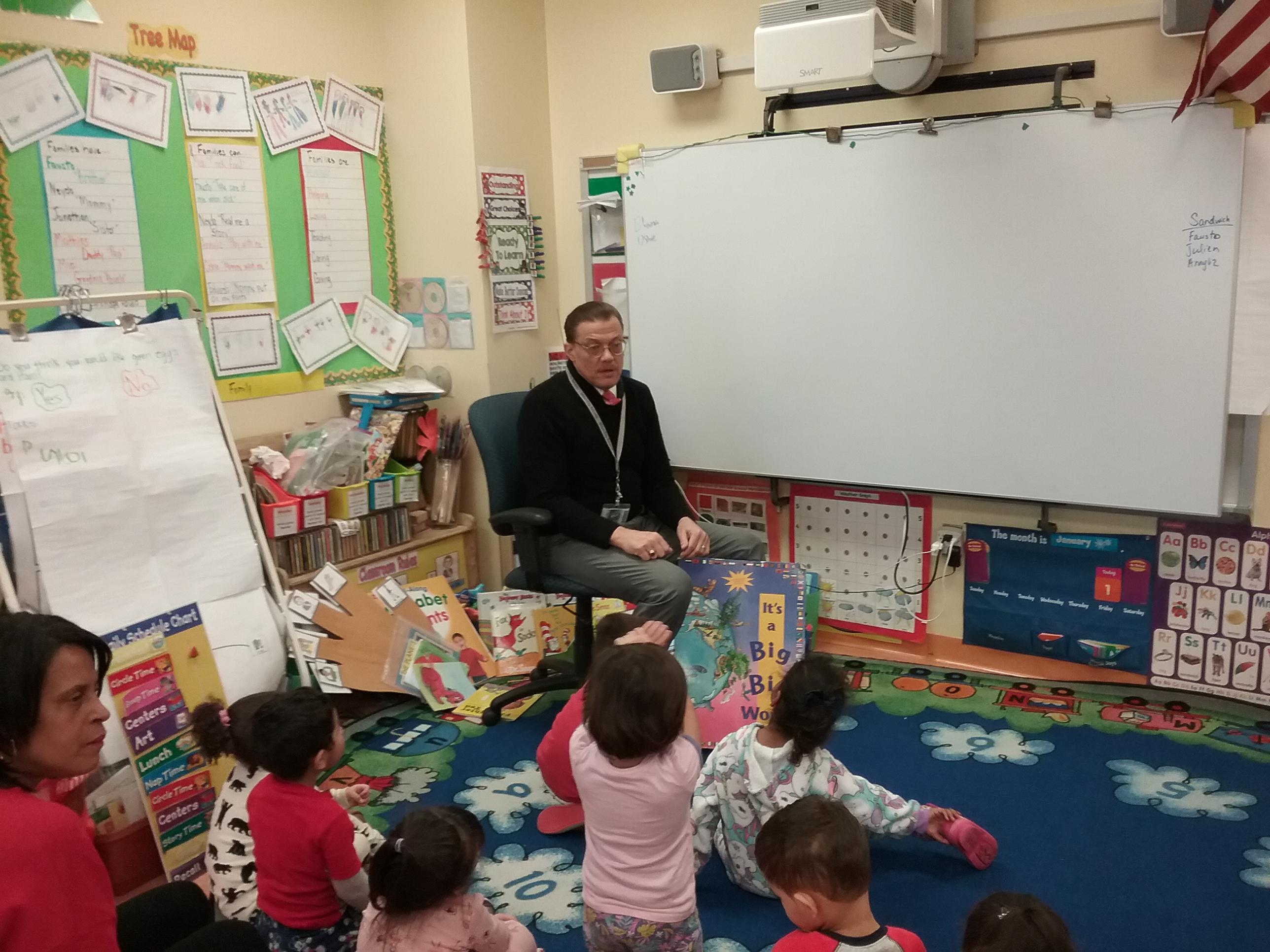 Charles Webster reading to students at ECC