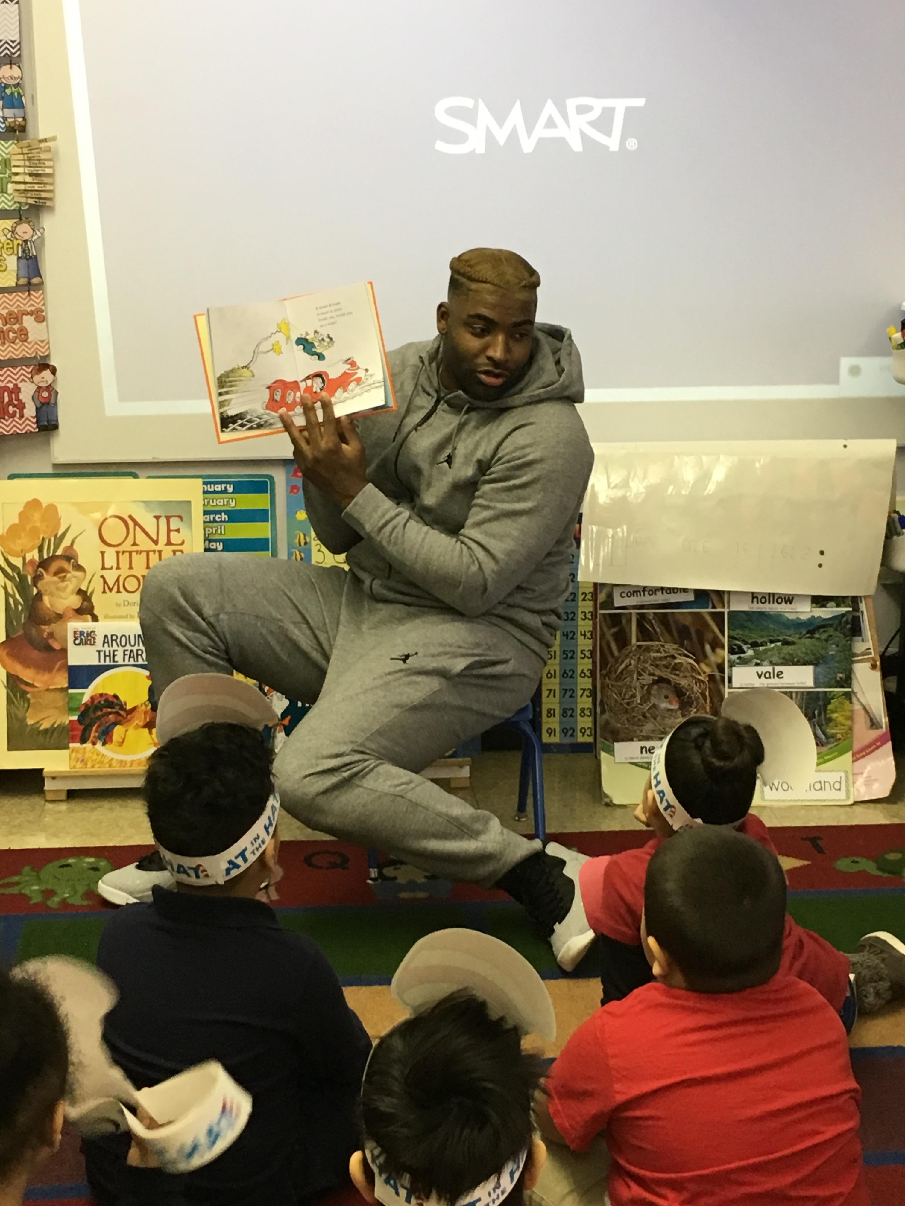 DE-Vinny Curry, NFL player reading to students at Edison School